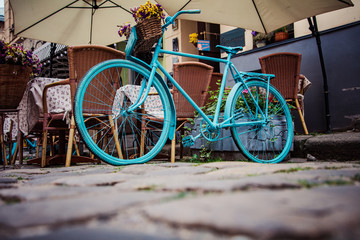 Fototapeta na wymiar Bicycle decoration near cafe in Lviv