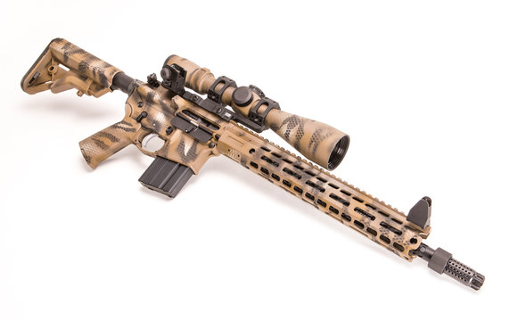 AR 15 Style Rifle With Desert Camouflage Pattern And Optic.