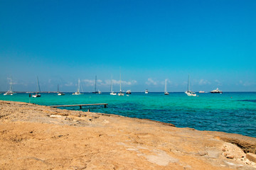beach with umbrellas and chairs-island formentera