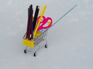 colored pencils in a trolley, back to school, office tools