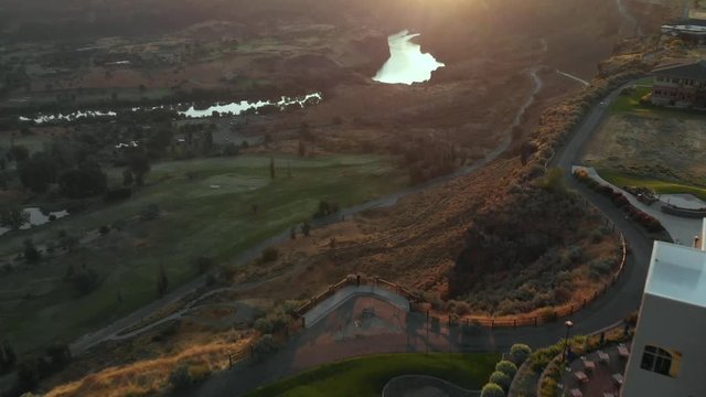 Aerial footage at sunrise flying over housing near cliff edge at Snake River Canyon in Twin Falls, Idaho, USA