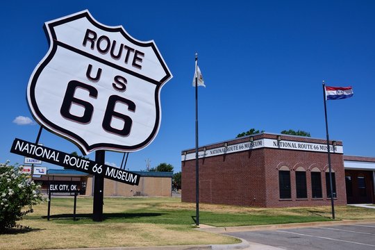 Elk City, Oklahoma - July 20, 2017: The Biggest Route US 66 Sign By The National Route 66 Museum In Elk City, Oklahoma. This Museum Complex Includes The Old Town Museum Which Displays The History Of E