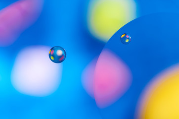 Colorful abstract images of oil drops on water. Colored circles and waves as a concept of scientific discovery, space or molecular research.