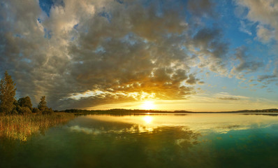 Fototapeta na wymiar View of sunset lake in summer