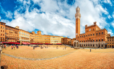 Panorama of Piazza del Campo (Campo square) and Torre del Mangia (Mangia tower) in Siena, Tuscany, Italy. Architecture and landmark of Siena, Tuscany, Italy. Attractions of Tuscany, Italy - obrazy, fototapety, plakaty