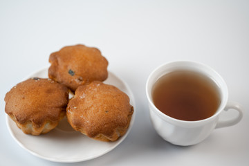 Cupcakes with tea on a white background