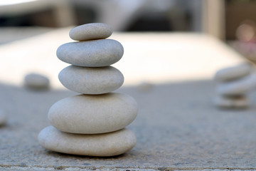 Detail of white piled stones. Balance and relaxation Concept.