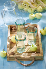 Homemade and fresh apple juice in hot summer