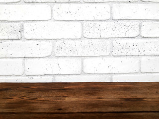 Empty wooden table on white bricks wall background. Mock up design for presentation products.