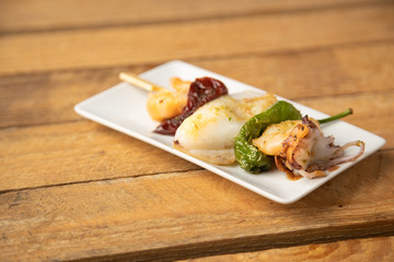 Skewer of sepia peppers and shrimp, typical Spanish tapa