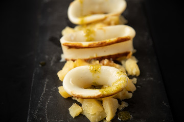 Spanish squid top with potatoes