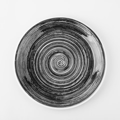 Dark brown plate on the yellow background