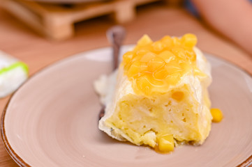 Traditional Slovenian dessert made of dough, cheese and fruit. Dumplings with mango for a delicious breakfast in a European cafe.