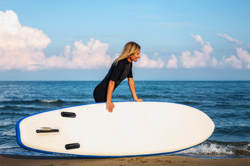 Active woman with surf board.