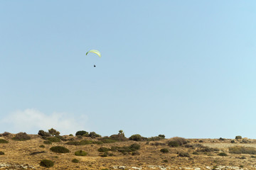 Fototapeta na wymiar Paraglider in the blue sky 