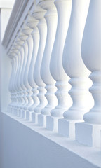 Sun and shadow play on classical columns, a simple architecture element.