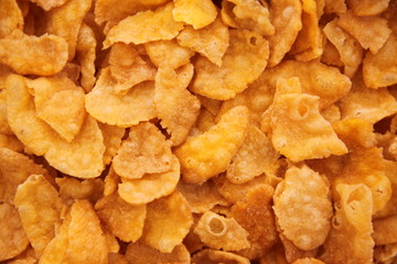 cornflakes in bowl on white background