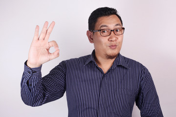 Fototapeta premium Young Man Showing Okay Gesture