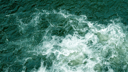 Bubbling water of a mountain river. Bubbling water flowing down a mountain river