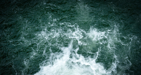 Bubbling water of a mountain river. Bubbling water flowing down a mountain river