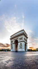 Fototapeta na wymiar Paris Triumphal Arch the Arc de Triomphe de l’Etoile at the western end of the Champs-Elysees at the centre of Place Charles de Gaulle, France. Early morning with nice sunrise light