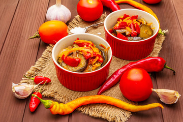 Marinated salad with pickled vegetables: eggplant, carrot, pepper, tomato, garlic