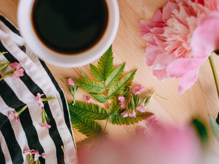 wedding rings on a bouquet of white roses
