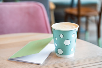 Paper coffee cup in mint green.