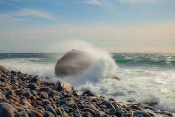 Large waves hit a rocky coastline in Norway