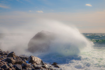 Large waves hit a rocky coastline in Norway