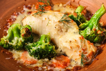 fish with broccoli (a delicious fish dish, baked main course) menu concept. food background. copy space. Top view