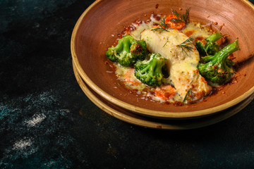 fish with broccoli (a delicious fish dish, baked main course) menu concept. food background. copy space. Top view