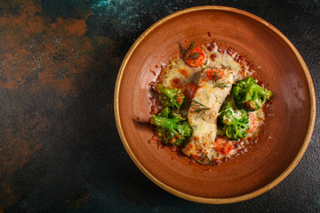 fish with broccoli (a delicious fish dish, baked main course) menu concept. food background. copy space. Top view