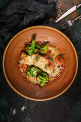 fish with broccoli (a delicious fish dish, baked main course) menu concept. food background. copy space. Top view