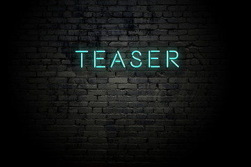 Highlighted brick wall with neon inscription teaser