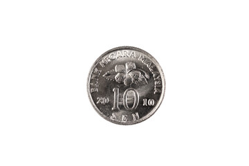 A close up, macro shot of a silver ten sen coin from Malaysia isolated on a clean, white background © Vitoria Holdings LLC