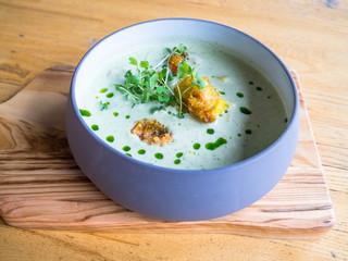 Cream soup of asparagus with shrimps, selective Focus