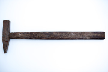 old rusty hammer isolated on white background