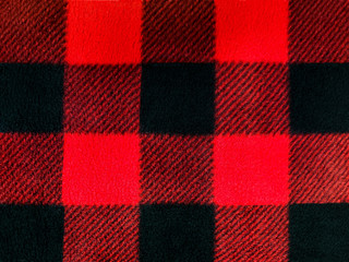 red and black lumberjack plaid pattern on fleece fabric