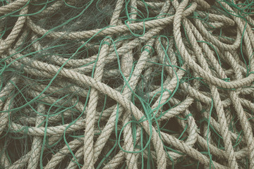 Ropes tangled in green fishing nets