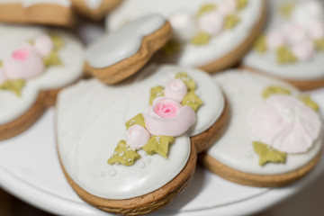 Closeup of gingerbread cookies in a white glaze. Stylish pastries as a decoration for the holidays.