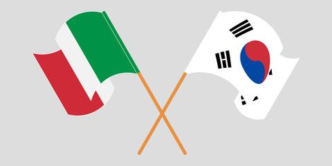 Crossed and waving flags of Italy and South Korea