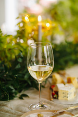 Wine in glass on table with candle light on background