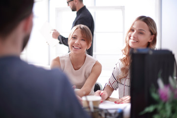 young business woman sitting at office Desk