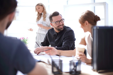 employees discussing ideas for a new project.