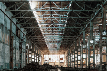 Ruined industrial hall of warehouse or hangar in process of reconstruction