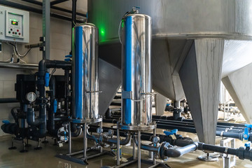 System of automatic treatment and multi-level filtration of drinking water produced from well. Plant or factory for production of purified drinking water