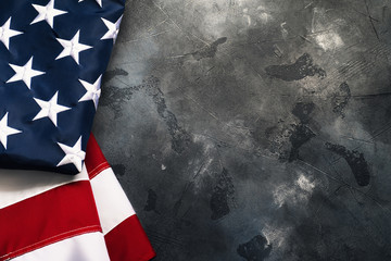 American or USA flag on concrete background with copy space for text, top view