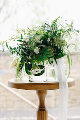 Green wedding  bouquet in glass bowl.