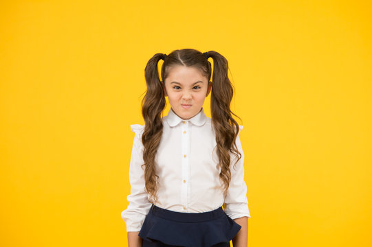 Picky kid. Adorable schoolgirl. Schoolgirl pupil long hair cute ponytails hairstyle. Educational program. Homeschooling visiting regular school. Efficiency studying. Emotional expression schoolgirl